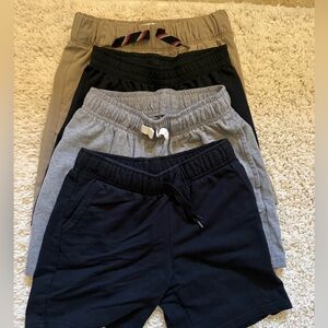4 pairs of Size 6/7 Shorts: 
Old Navy, Nike, and Cat & Jack